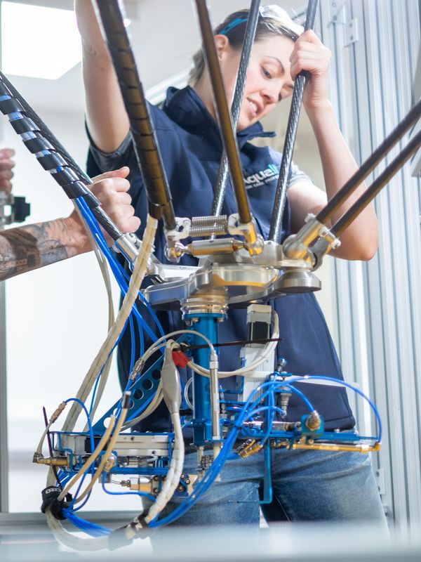 An Aqualife Team Member operating equipment