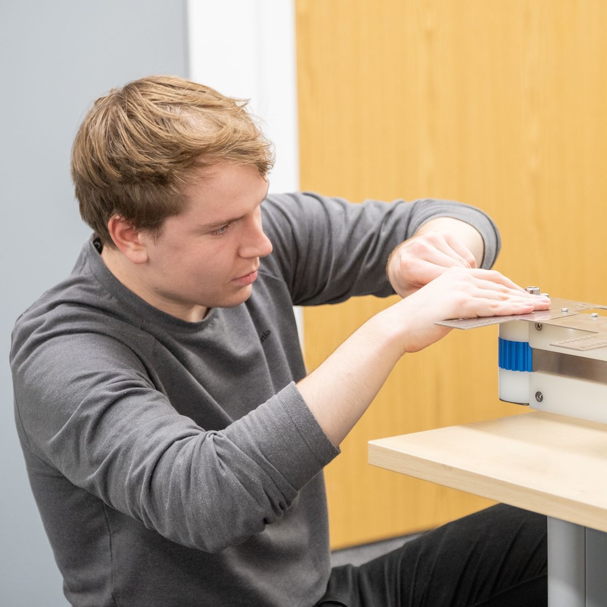 An Aqualife team member manufacturing a metal component